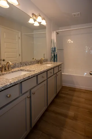 a white toilet sitting next to a white wall