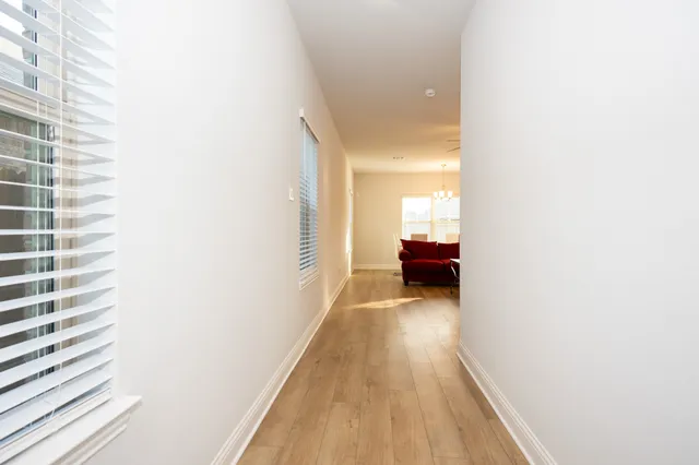 a view of a room with wooden floor