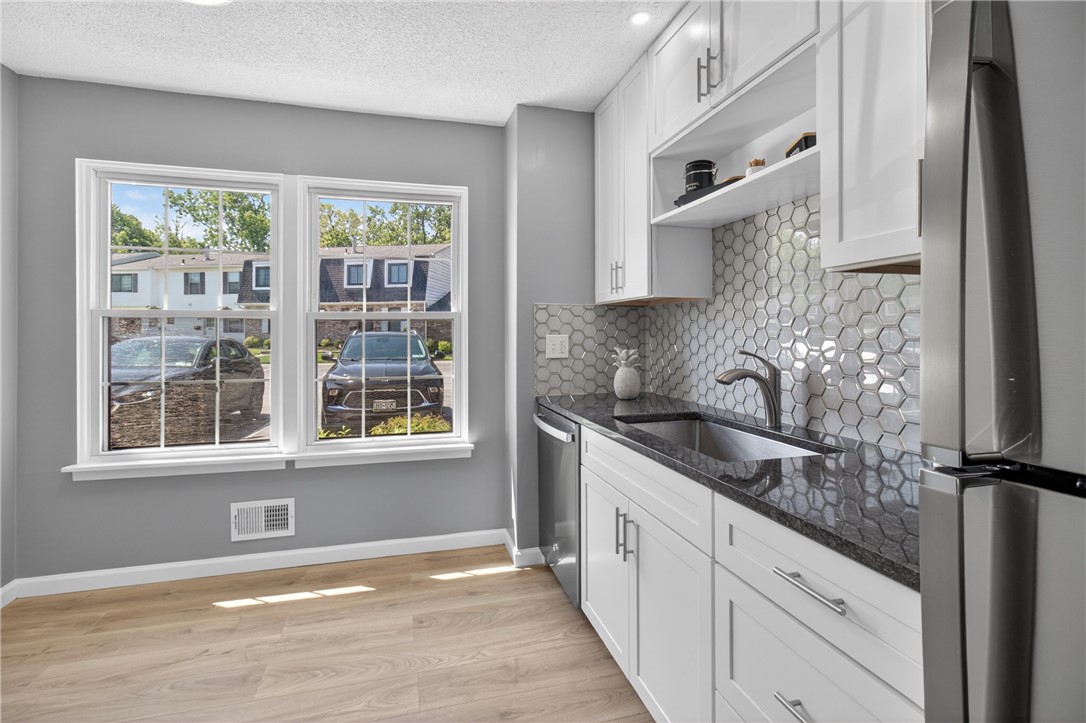 561 French Road Brighton, NY 14618 - Photo 5 of 45 EAT-IN-AREA AND FLOODED WITH SUNLIGHT