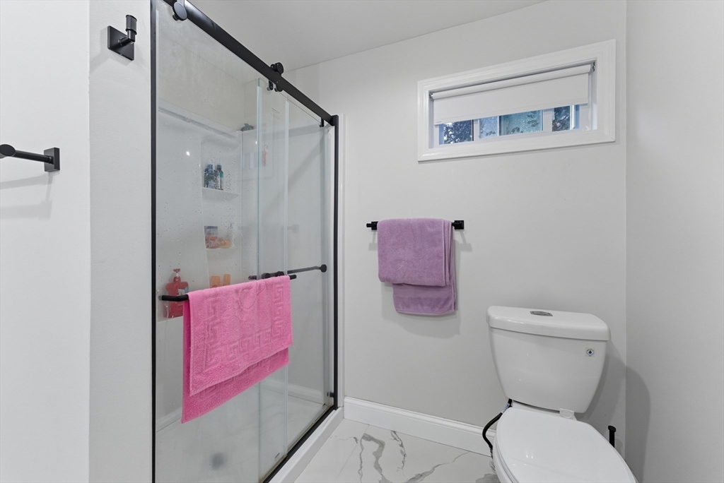 24 Elm Street Ludlow, MA 01056 - Photo 15 of 39 a white toilet sitting next to a bathroom sink