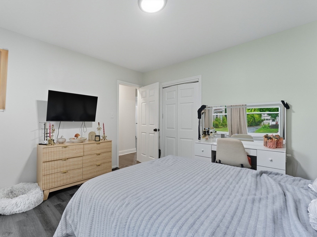 24 Elm Street Ludlow, MA 01056 - Photo 18 of 39 a bedroom with a bed and a flat screen tv