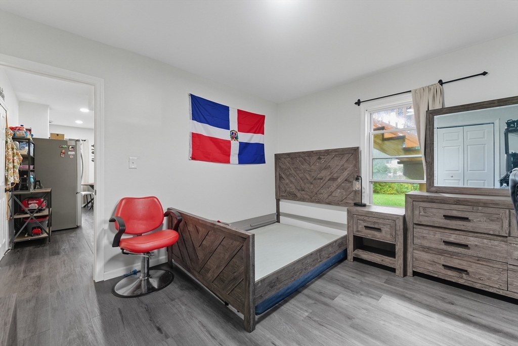 24 Elm Street Ludlow, MA 01056 - Photo 20 of 39 a bedroom with a bed and a dresser in it