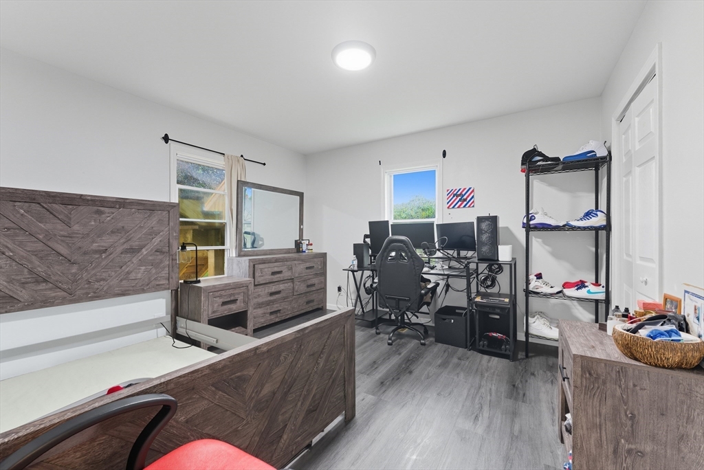 24 Elm Street Ludlow, MA 01056 - Photo 21 of 39 a living room with furniture and a flat screen tv