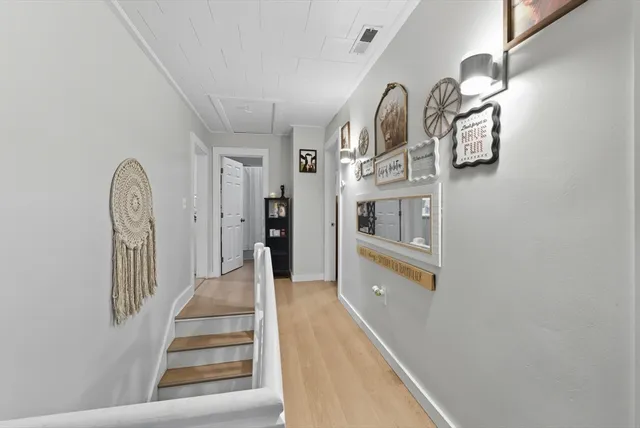 a kitchen with a sink cabinets and a window