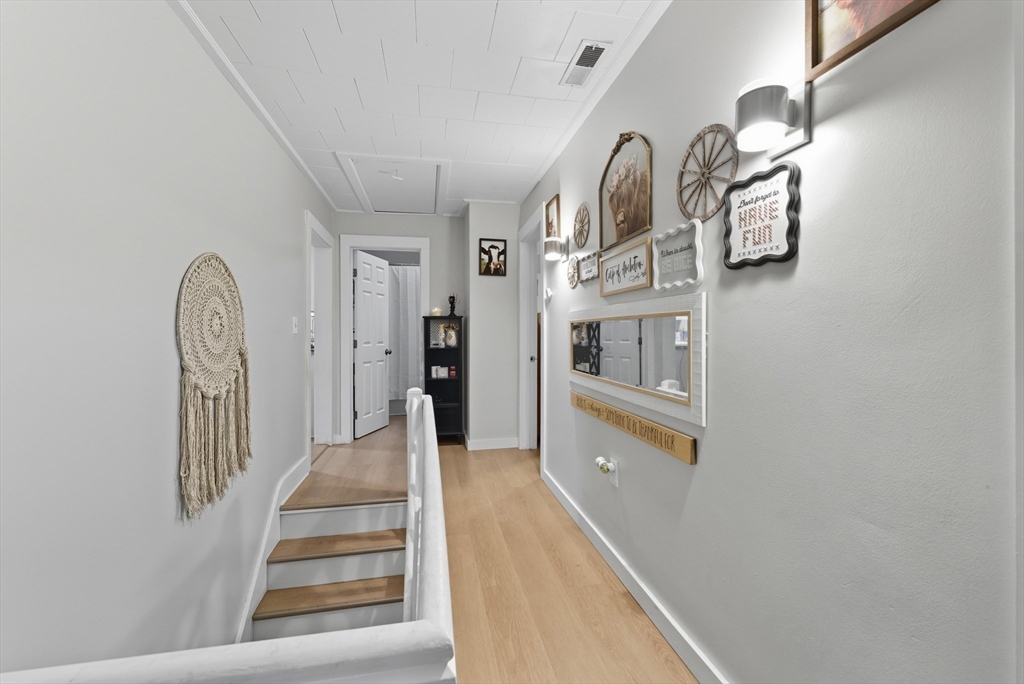 24 Elm Street Ludlow, MA 01056 - Photo 22 of 39 a view of entryway and hall with wooden floor