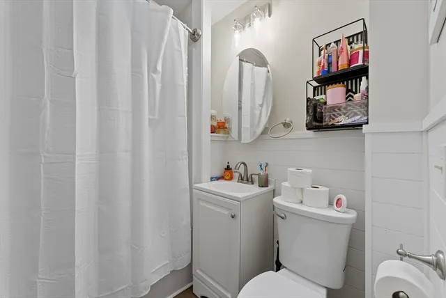 a bed room with a bed and a chandelier