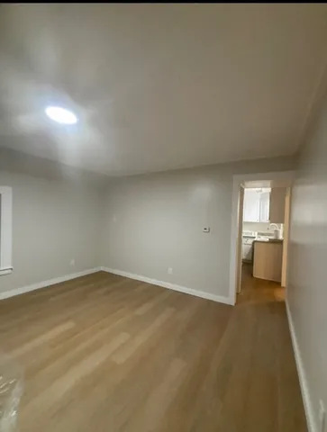 a bedroom with furniture and a flat screen tv