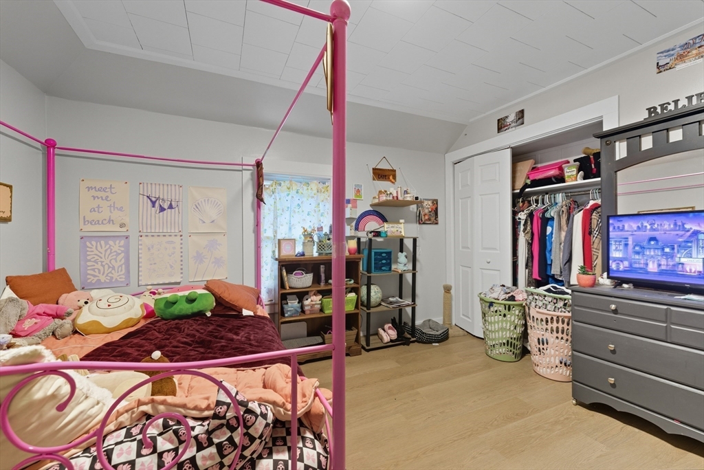 24 Elm Street Ludlow, MA 01056 - Photo 30 of 39 a bed room with a bed and a flat screen tv