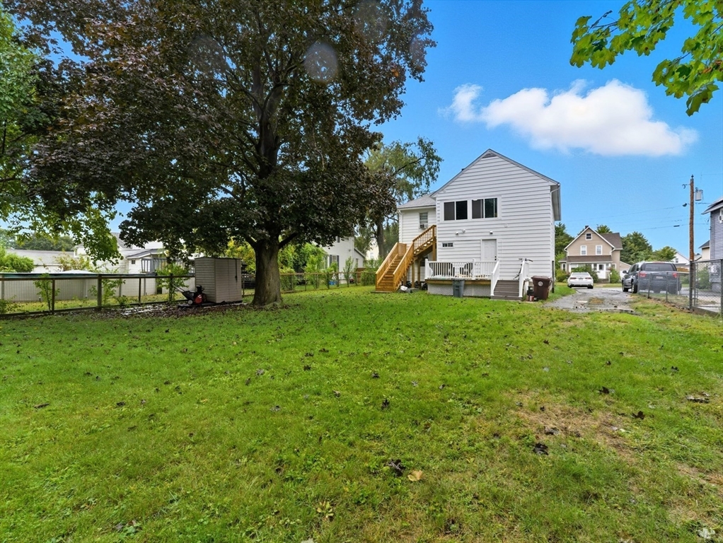 24 Elm Street Ludlow, MA 01056 - Photo 33 of 39 a front view of a house with a yard and trees