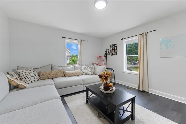 a living room with furniture and window