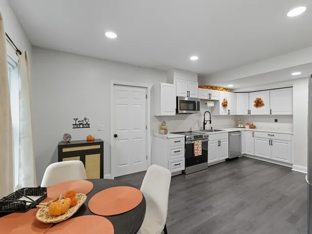 a dining room with furniture and window