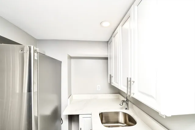 a bathroom with a tub and a sink