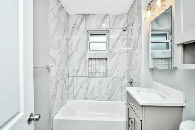 a bathroom with a sink and a bathtub
