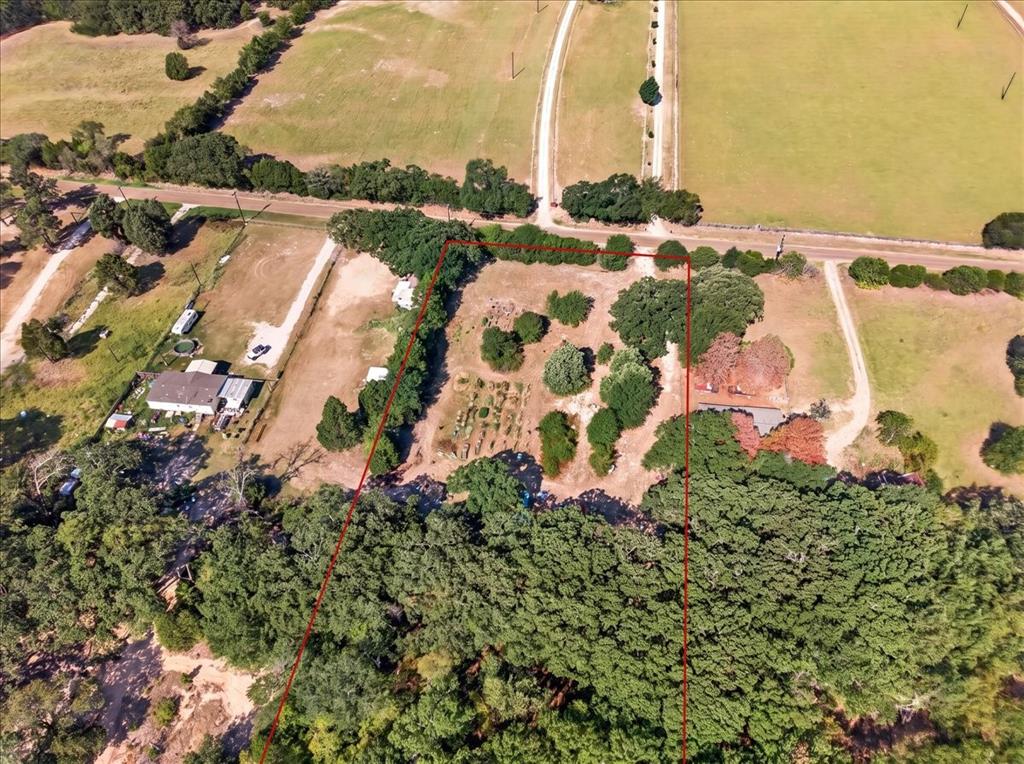 Expansive undeveloped land featuring mature tree lines and clearings