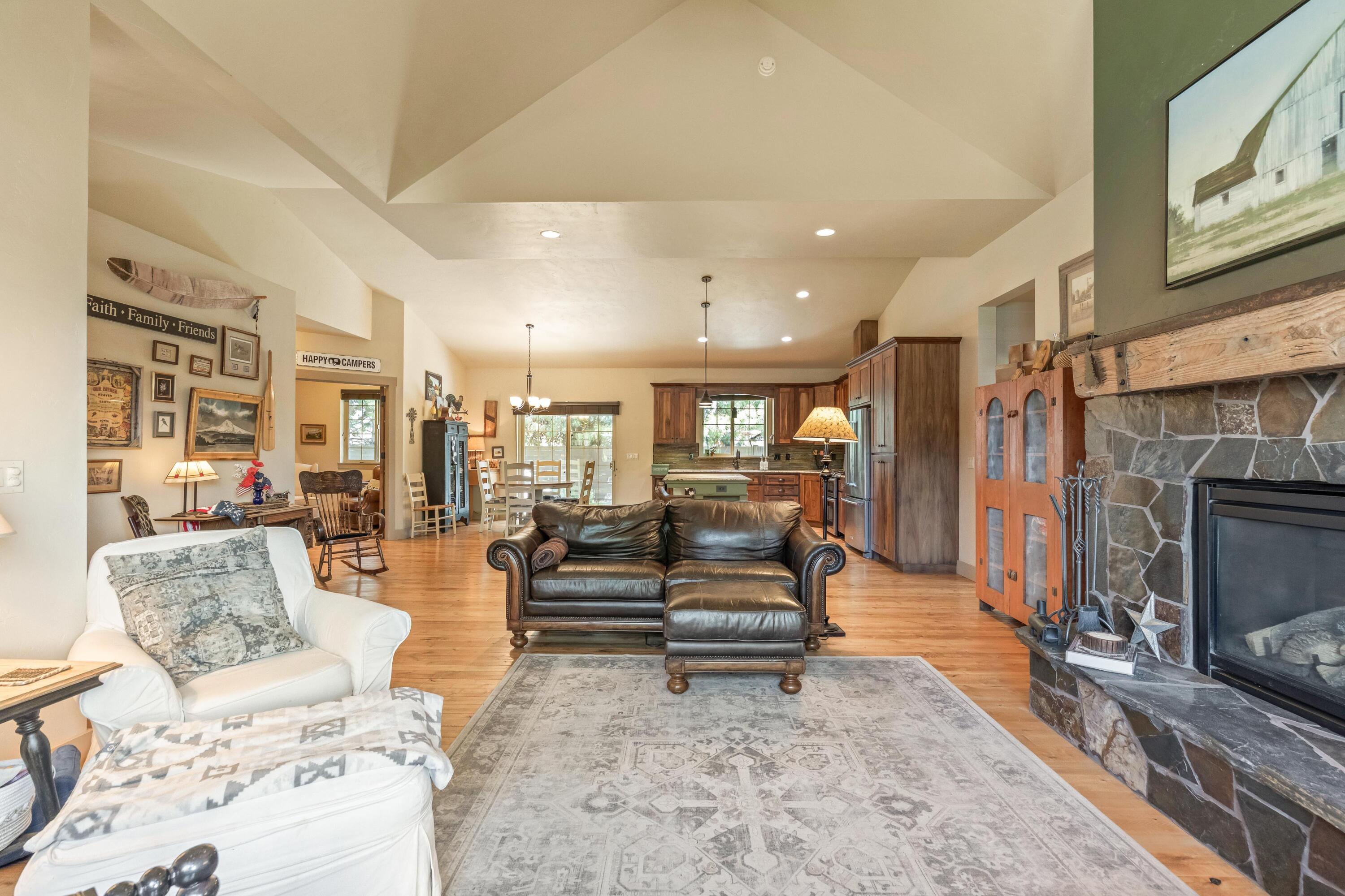 210 Northwest Saddle Ridge Loop Prineville, OR 97754 - Photo 7 of 38 a living room with furniture and a fireplace