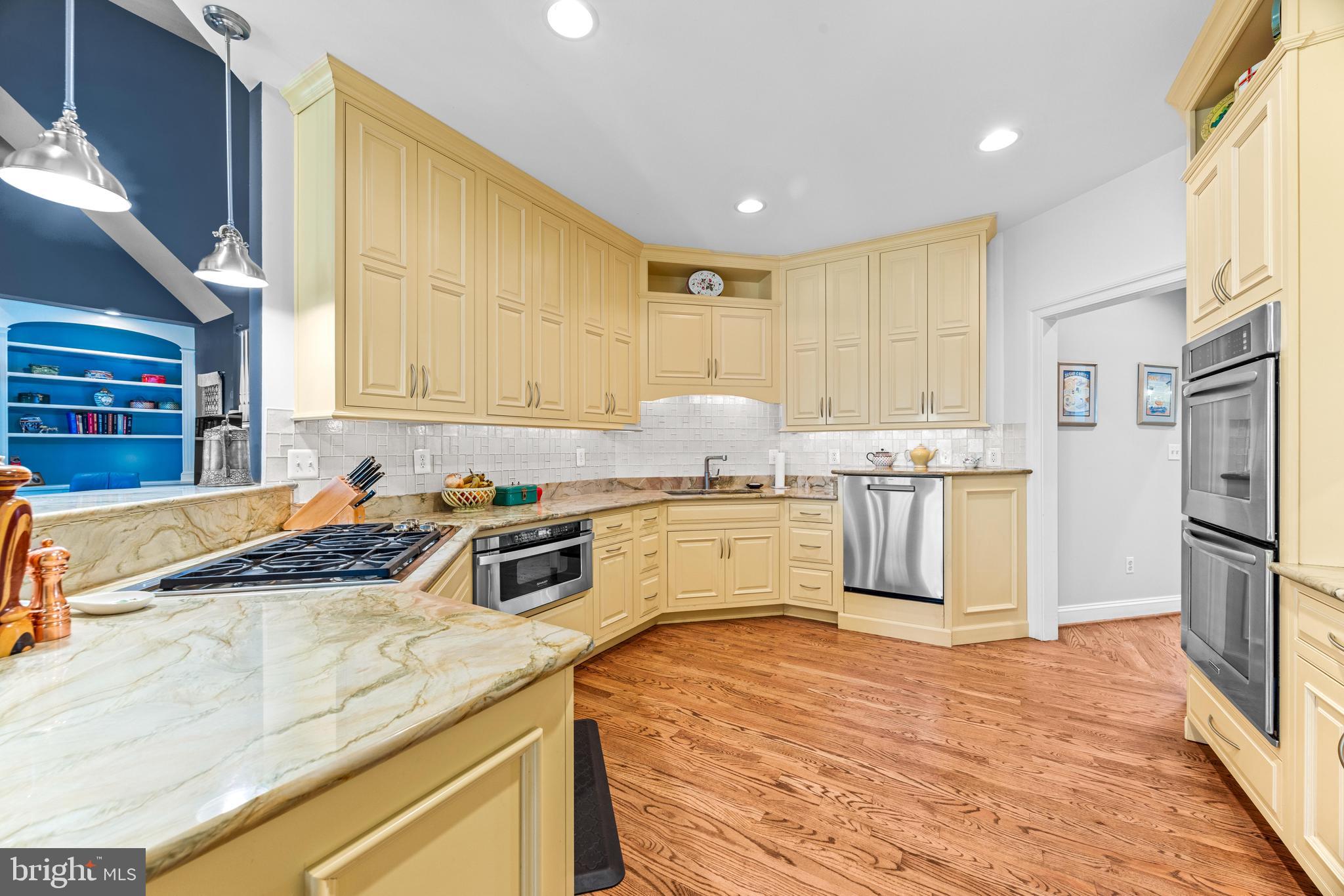 1402 Magers Landing Road Monkton, MD 21111 - Photo 14 of 64 a kitchen with a refrigerator sink and cabinets