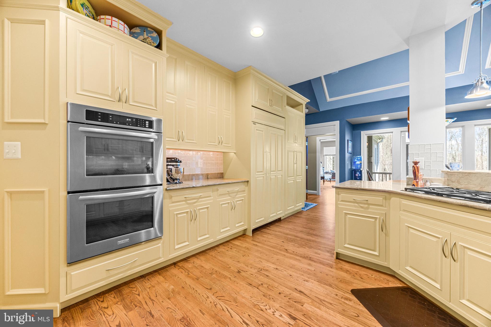 1402 Magers Landing Road Monkton, MD 21111 - Photo 16 of 64 a kitchen with stainless steel appliances granite countertop a stove and a microwave