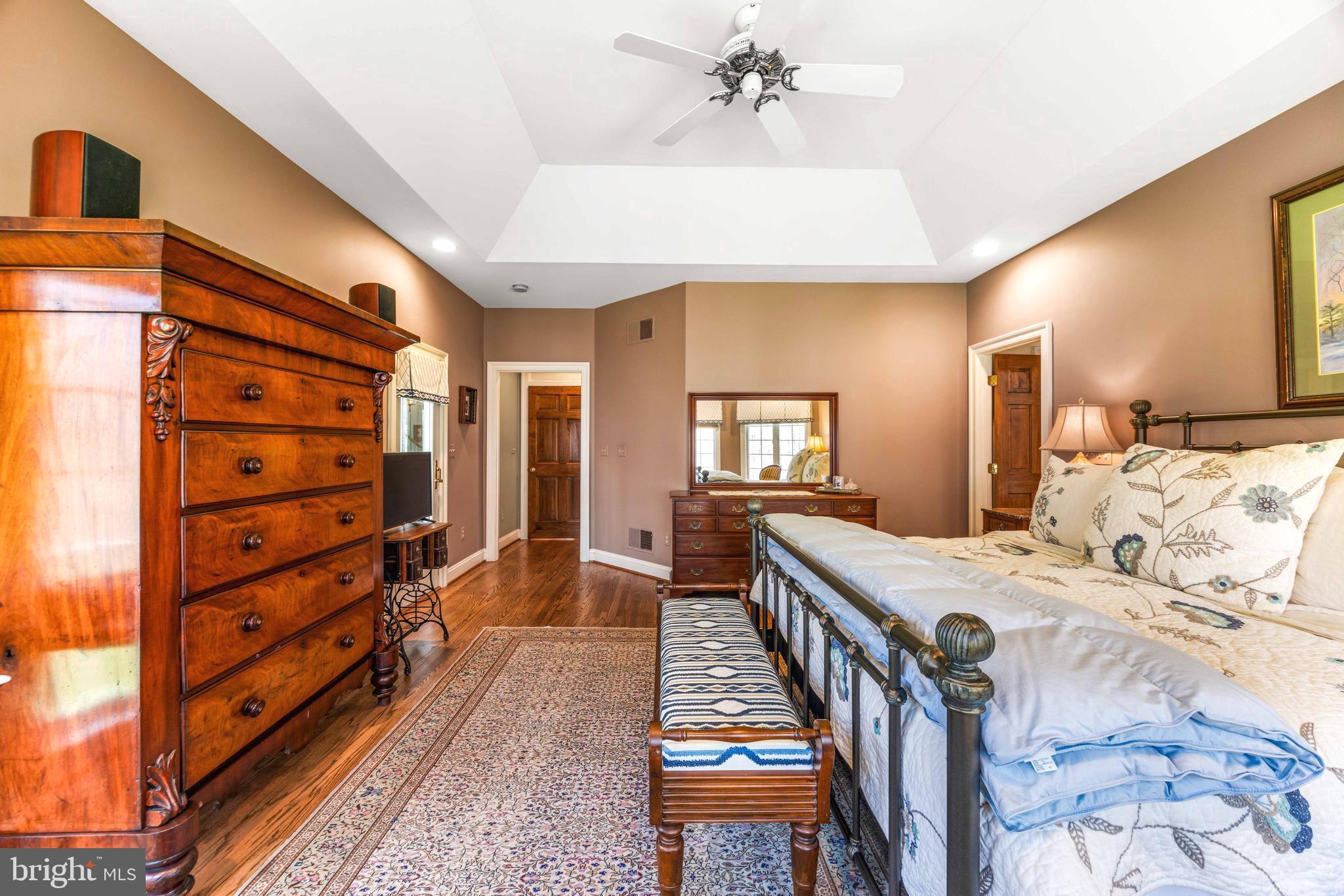 1402 Magers Landing Road Monkton, MD 21111 - Photo 28 of 64 a very nice looking room with a large bed and a chandelier
