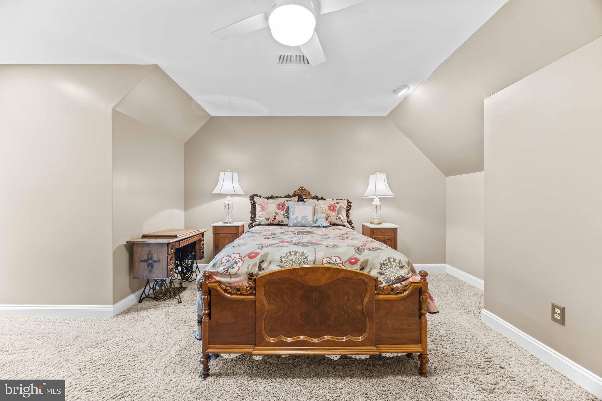 1402 Magers Landing Road Monkton, MD 21111 - Photo 39 of 64 a spacious bedroom with a bed and a table