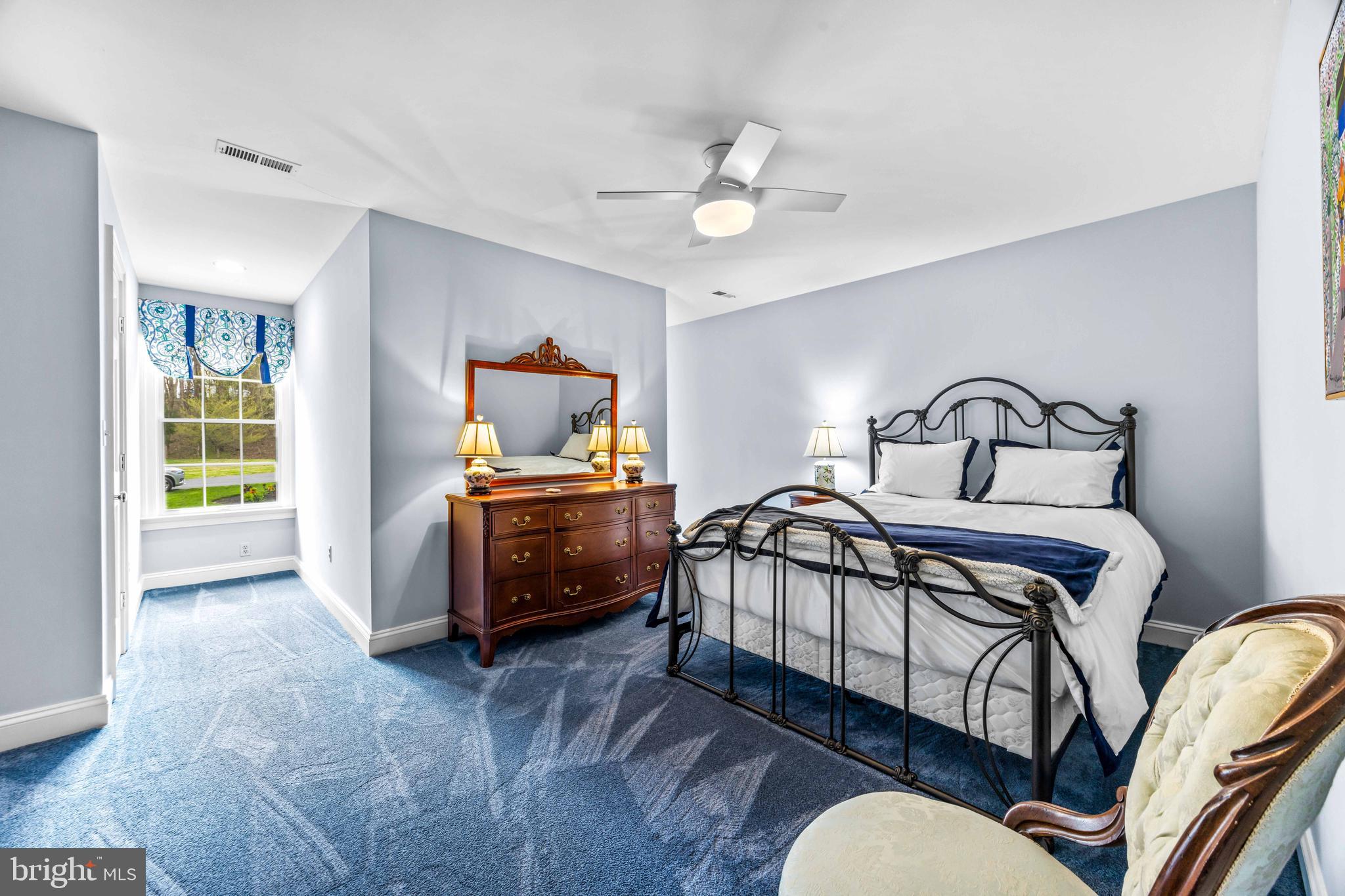 1402 Magers Landing Road Monkton, MD 21111 - Photo 40 of 64 a bedroom with a bed and wooden floor