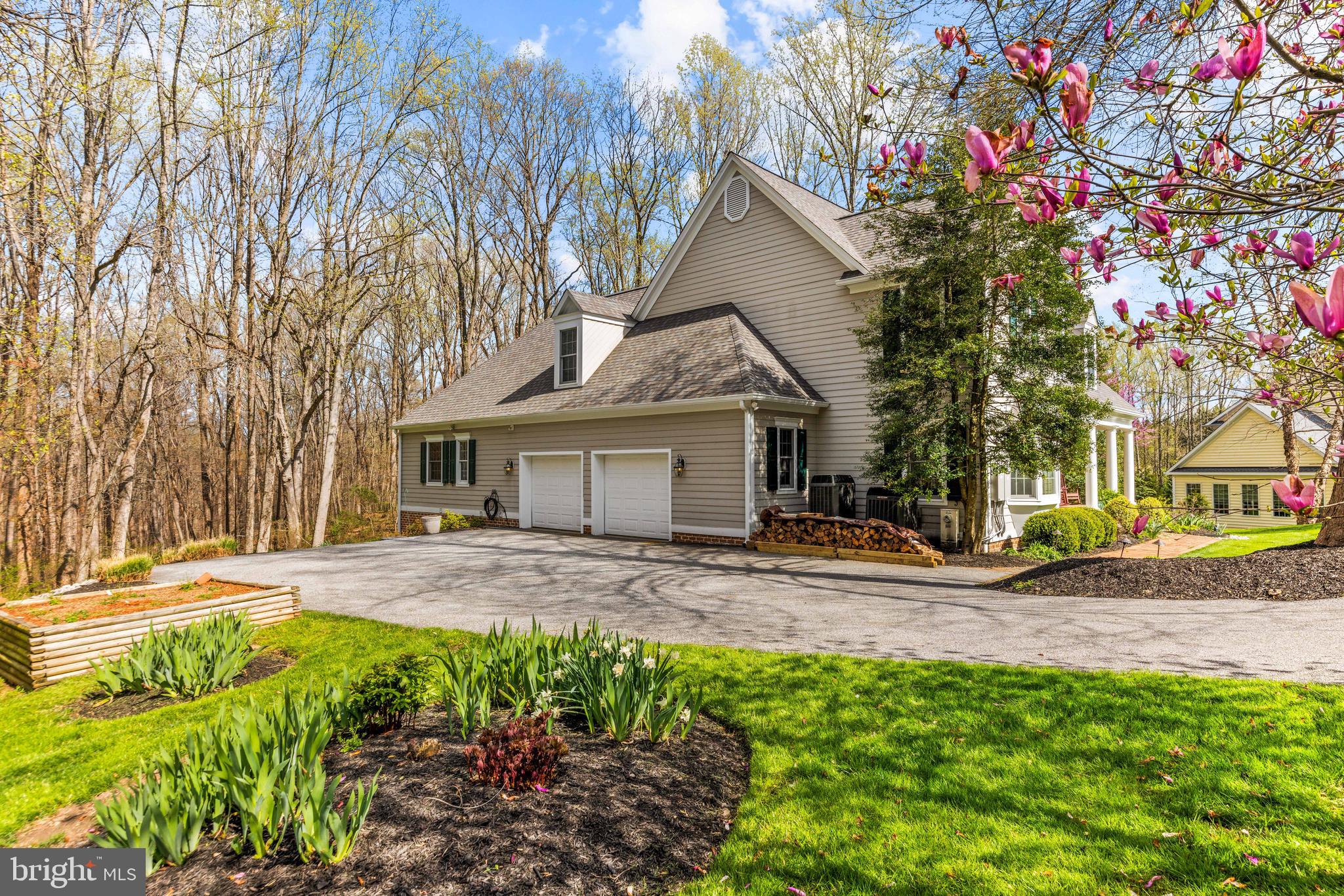 1402 Magers Landing Road Monkton, MD 21111 - Photo 53 of 64 a view of a yard in front of a house with large tree