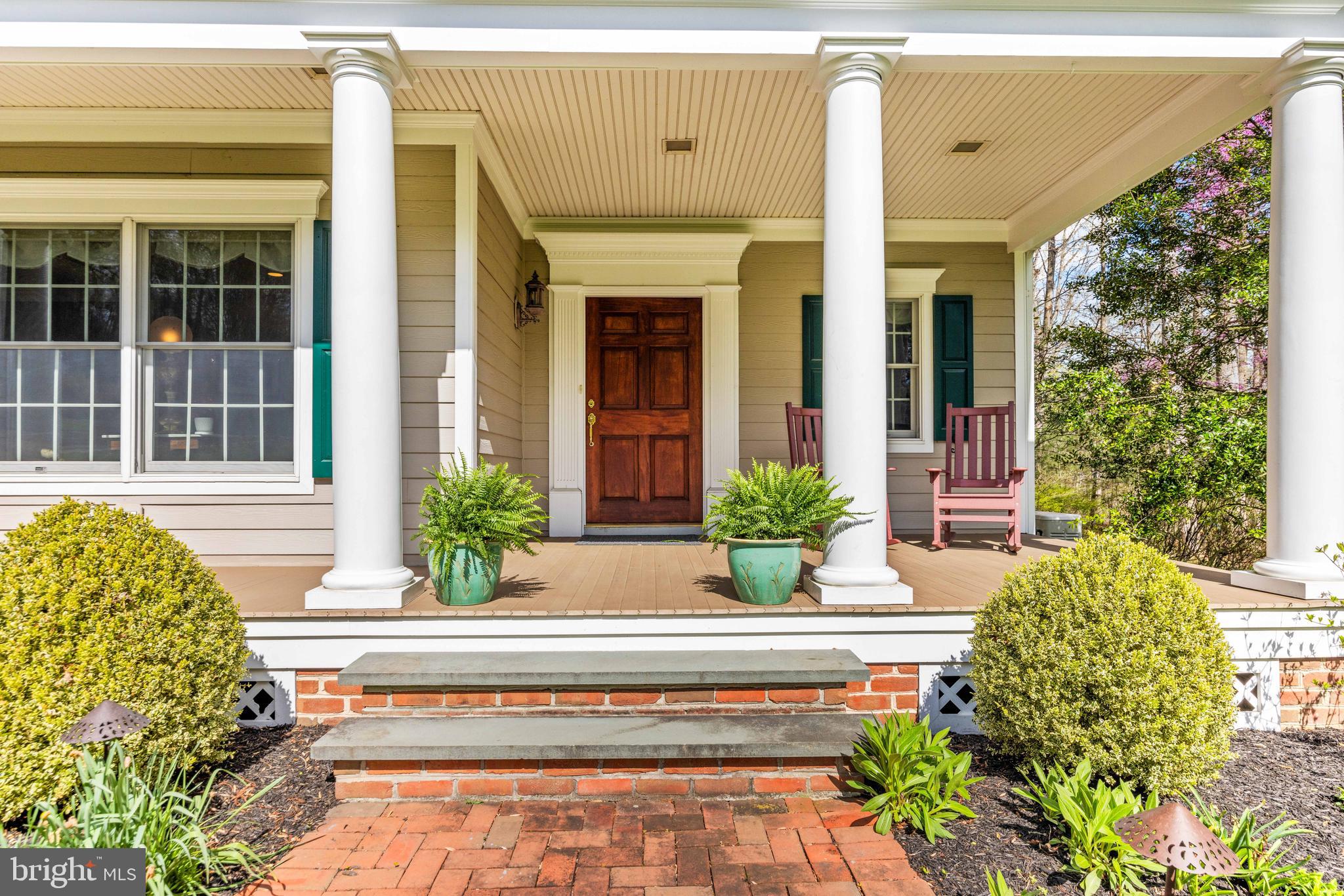 1402 Magers Landing Road Monkton, MD 21111 - Photo 55 of 64 a view of a house with potted plants and a large tree