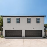 a front view of a house with garage