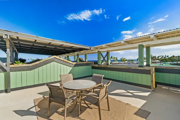 a view of a chairs and table in the patio