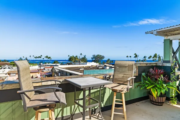 a view of a chairs and table in a patio