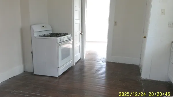 a kitchen with stainless steel appliances a stove and a refrigerator