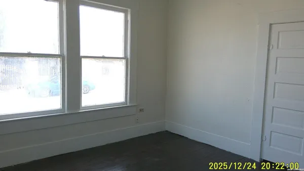 a view of an empty room and window
