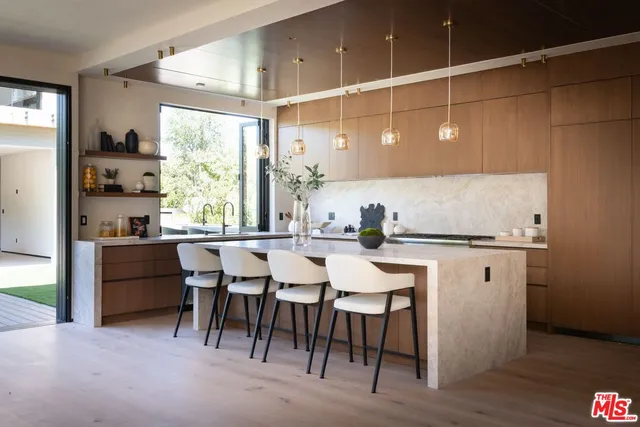 a kitchen with a table and chairs in it