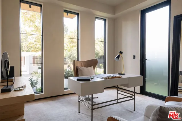 a workspace with furniture and a window