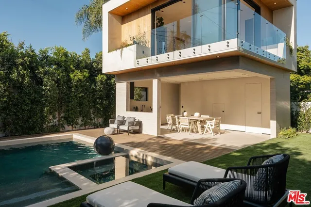 a outdoor living space with patio furniture and potted plants