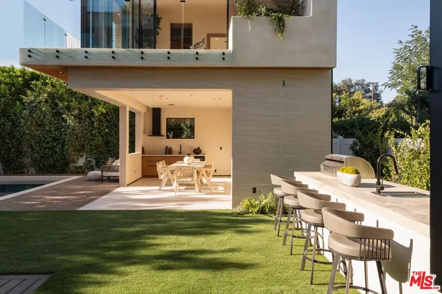 a view of a patio with swimming pool table and chairs
