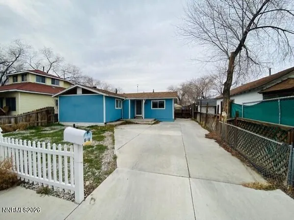 a front view of a house with parking space
