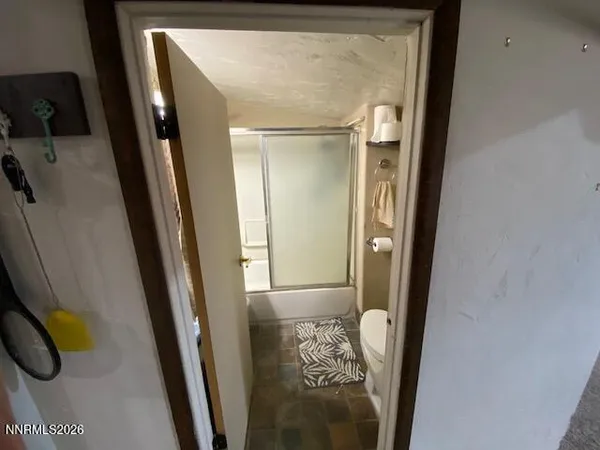 a view of a livingroom with furniture and a fireplace