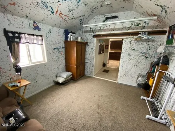 a wooden bench sitting in middle of a field