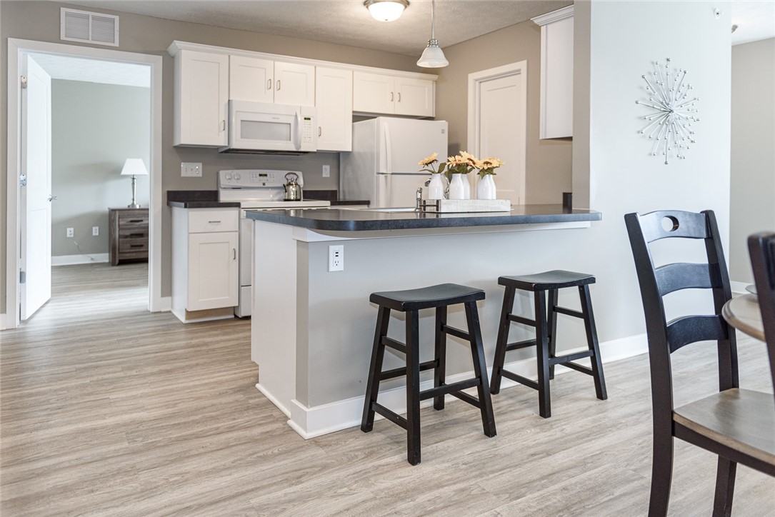 303 New Terrace Lane Rochester, NY 14624 - Photo 2 of 11 Typical kitchen with breakfast bar & pantry