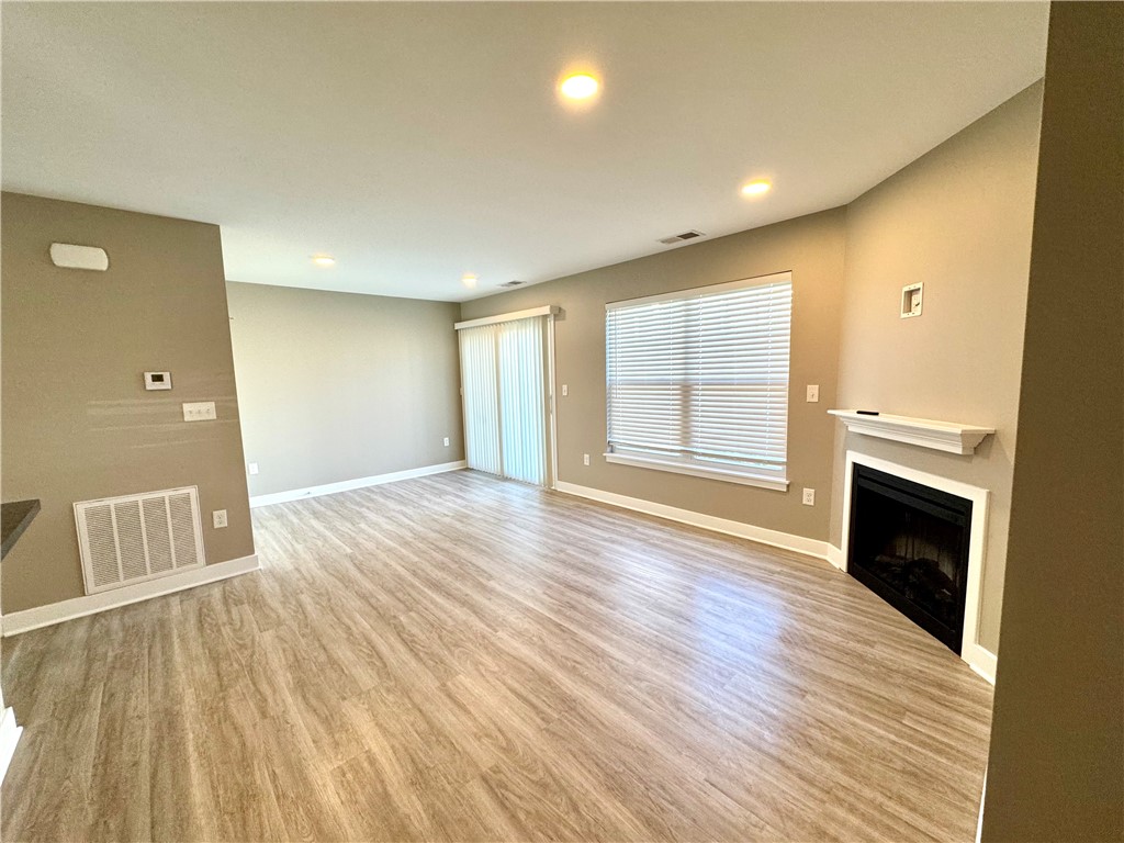 303 New Terrace Lane Rochester, NY 14624 - Photo 6 of 11 Typical view of great room towards dining area and