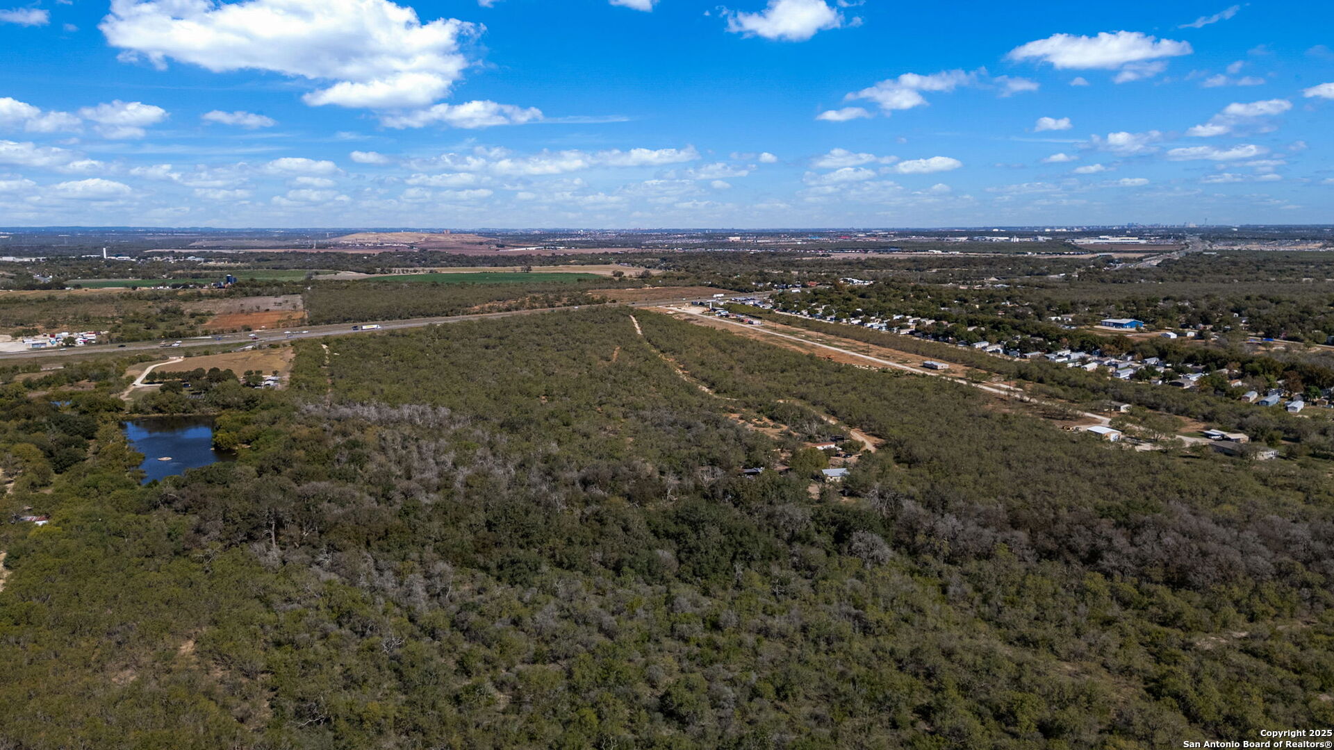 14350 Interstate 35 Access Road Von Ormy, TX 78073 - Photo 17 of 45 a view of a city with an ocean beach