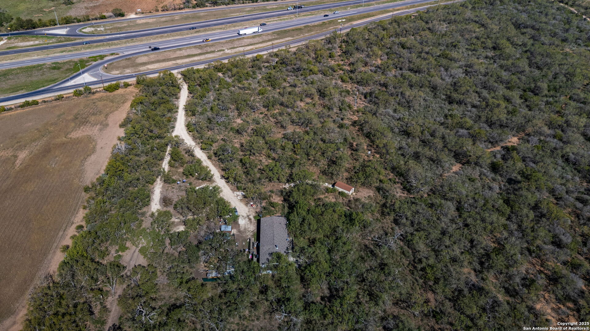 14350 Interstate 35 Access Road Von Ormy, TX 78073 - Photo 19 of 45 a view of a yard