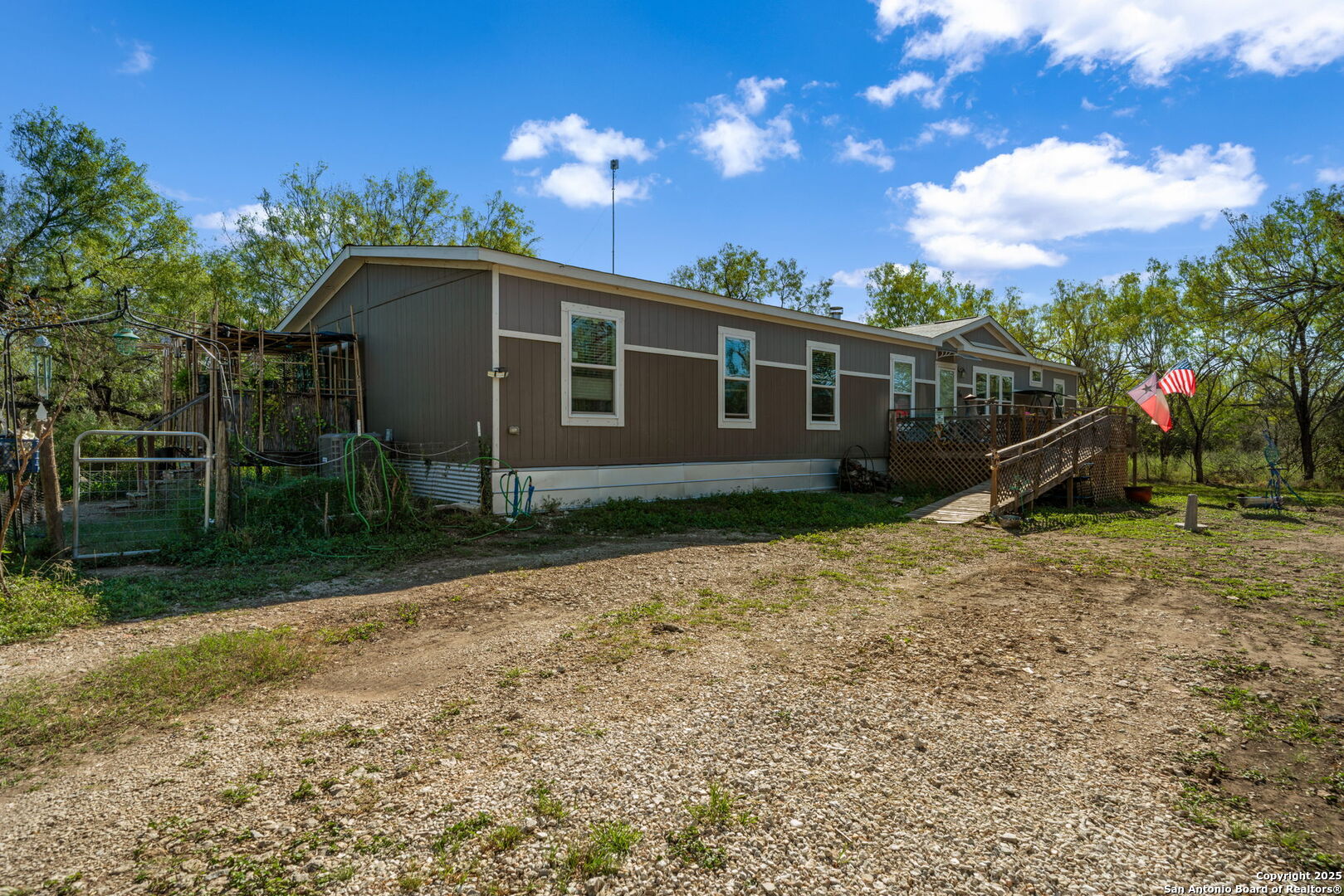14350 Interstate 35 Access Road Von Ormy, TX 78073 - Photo 23 of 45 a view of a house with a backyard
