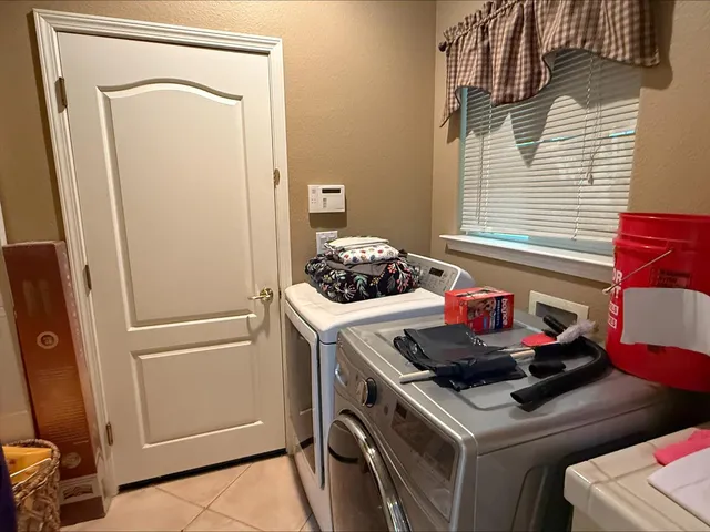 a kitchen with a stove and a refrigerator