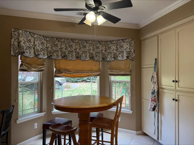 a view of a dining room with furniture window and outside view
