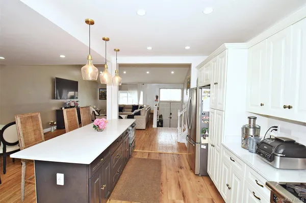 a dining room with furniture and wooden floor