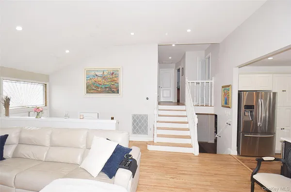 a bathroom with a sink toilet vanity and tub