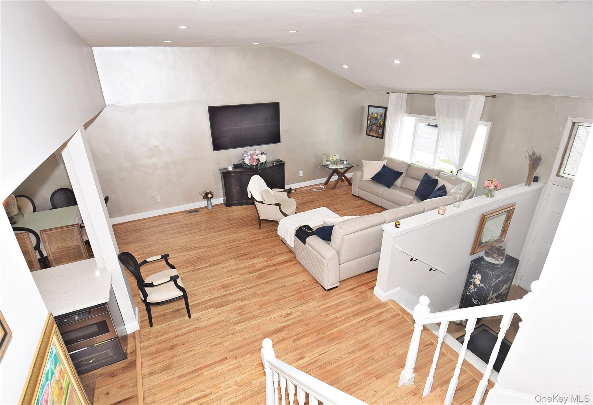 3029 Ann Street Baldwin, NY 11510 - Photo 15 of 26 a living room with furniture and a flat screen tv