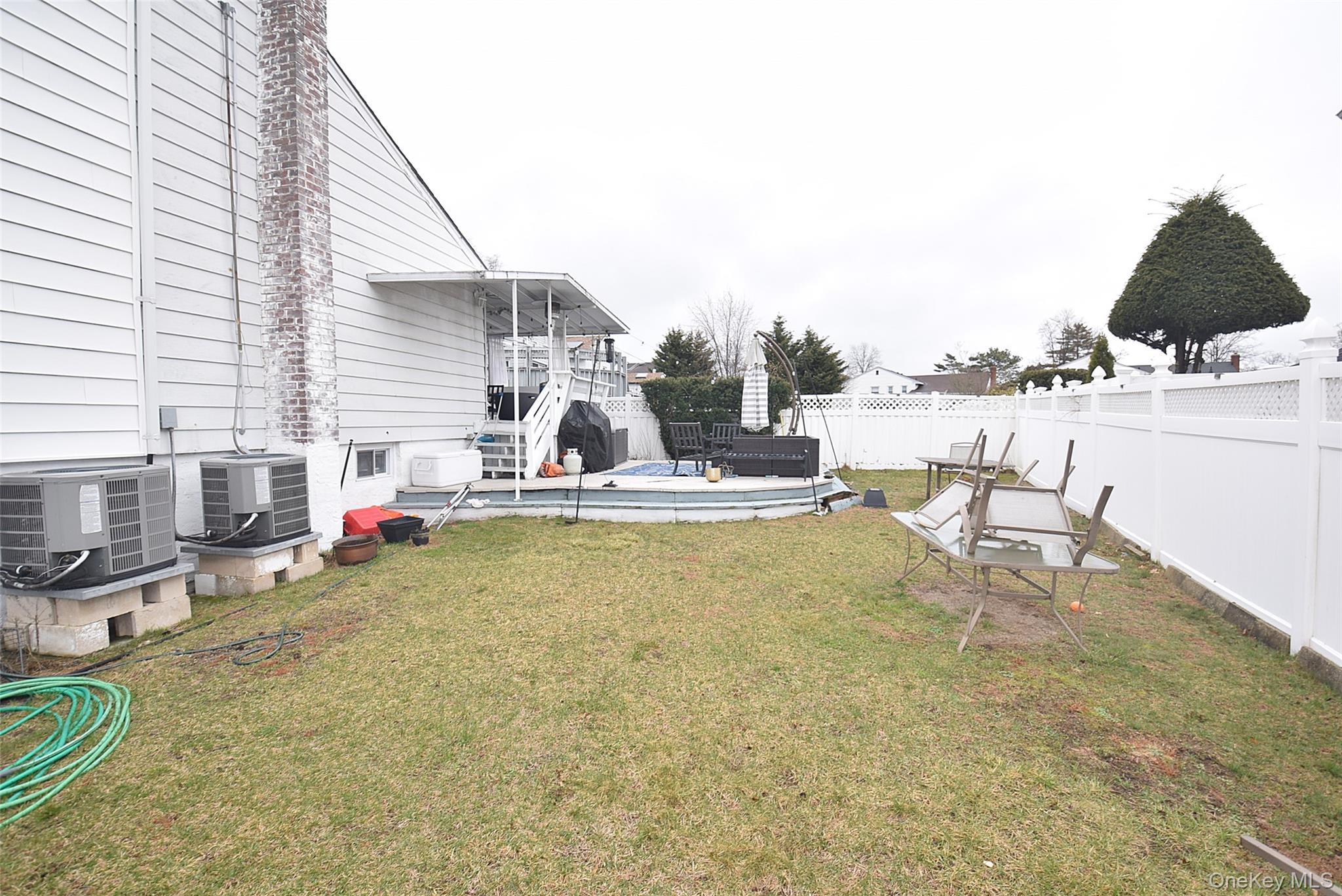3029 Ann Street Baldwin, NY 11510 - Photo 24 of 26 a view of a swimming pool with chairs