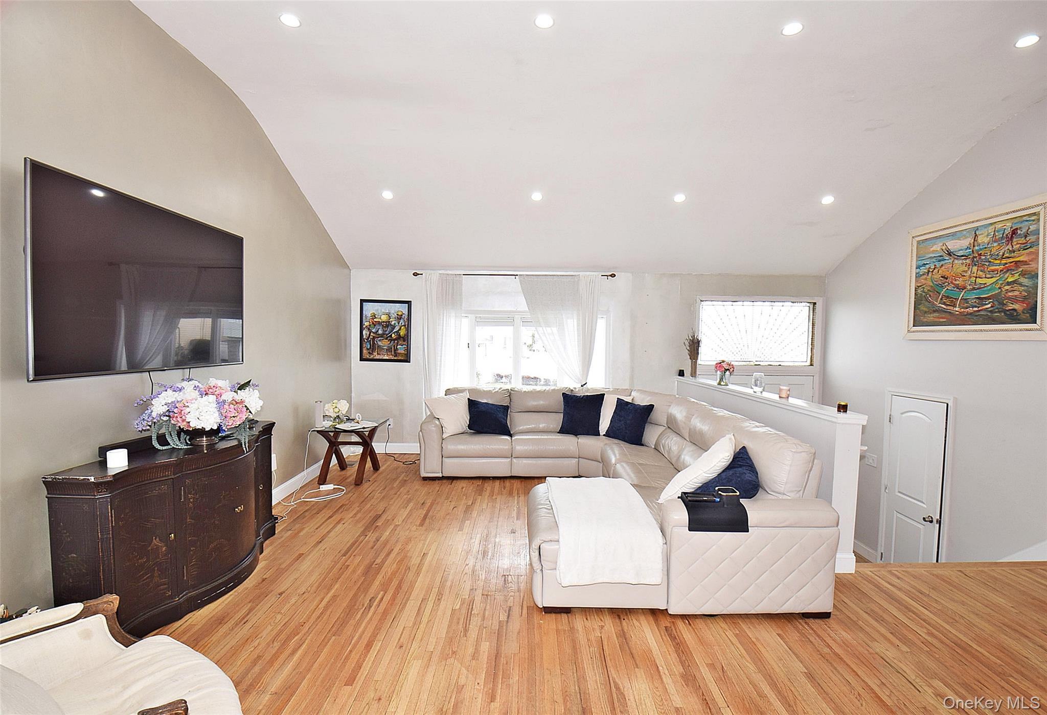 3029 Ann Street Baldwin, NY 11510 - Photo 4 of 26 a living room with furniture and a flat screen tv